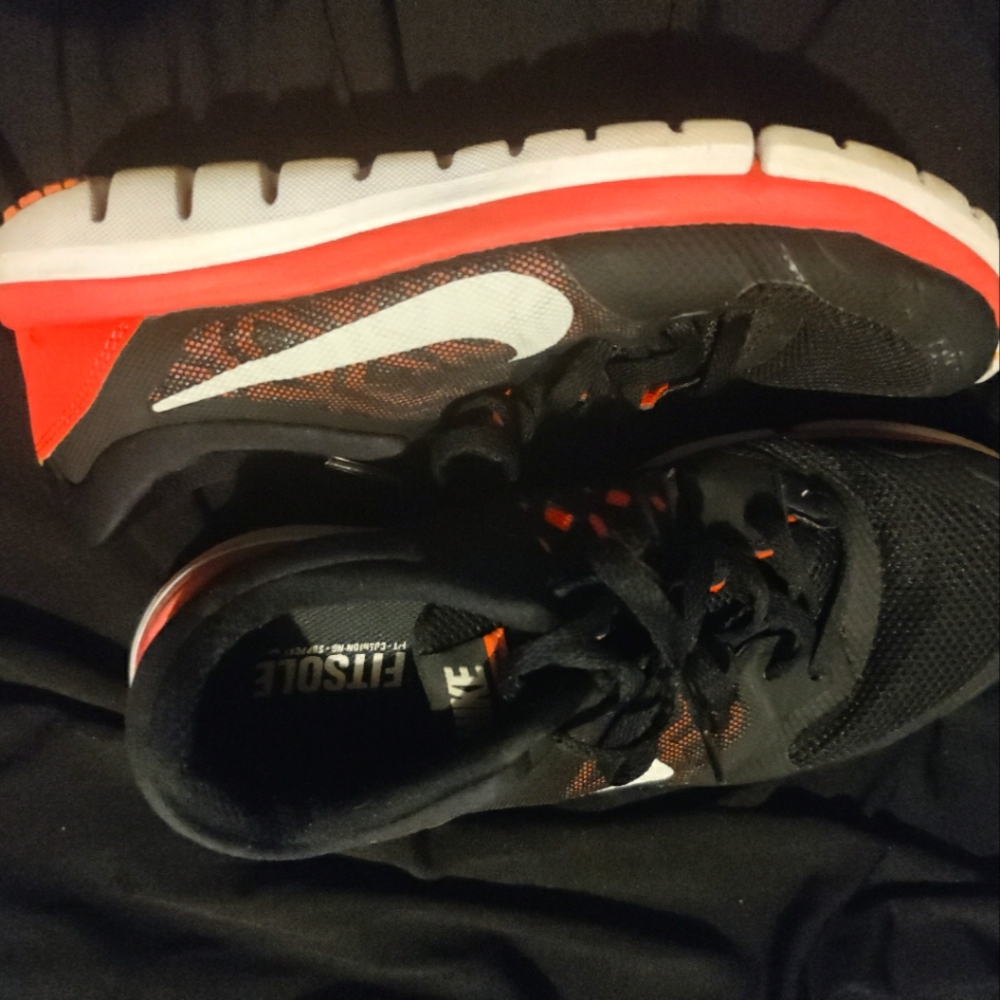 Orange blk and white nikes